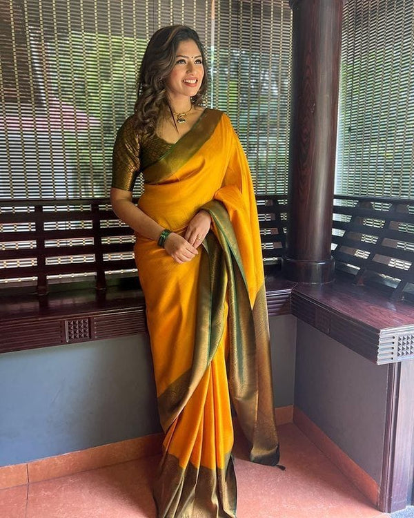Dazzling Yellow Soft Silk Saree With Beautiful Blouse Piece